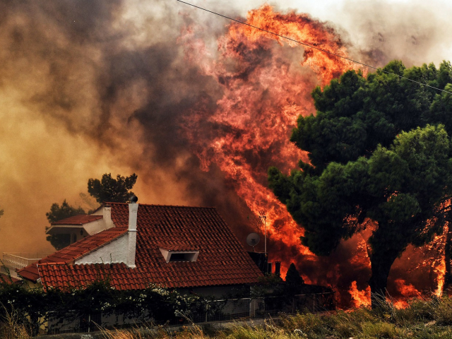 Forest fires rage across Greece