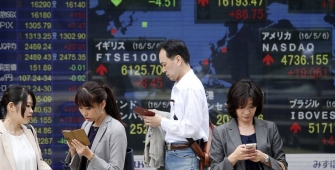 Asian Shares Slip Amid a Firm Dollar